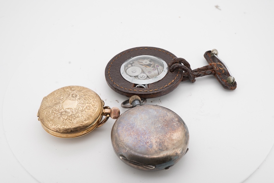 A lady's early 20th century continental 9k open faced keyless fob watch, with engraved yellow Roman dial, case diameter 28mm, together with a Swiss 935 standard white metal fob watch and a leather cased steel lapel watch